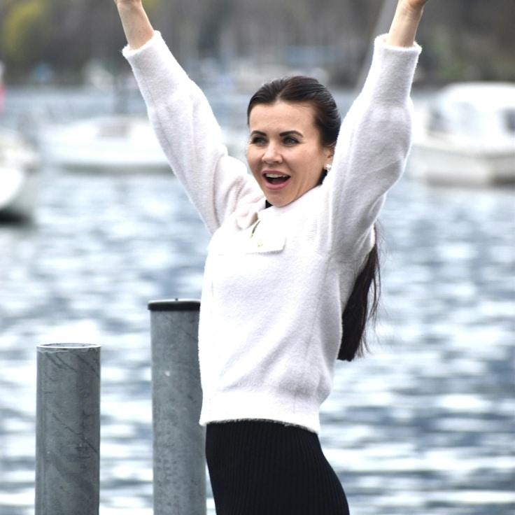 Kaveri Mehta, Lead Design Curator at MellowSectorPulse, reviewing corporate floral arrangements